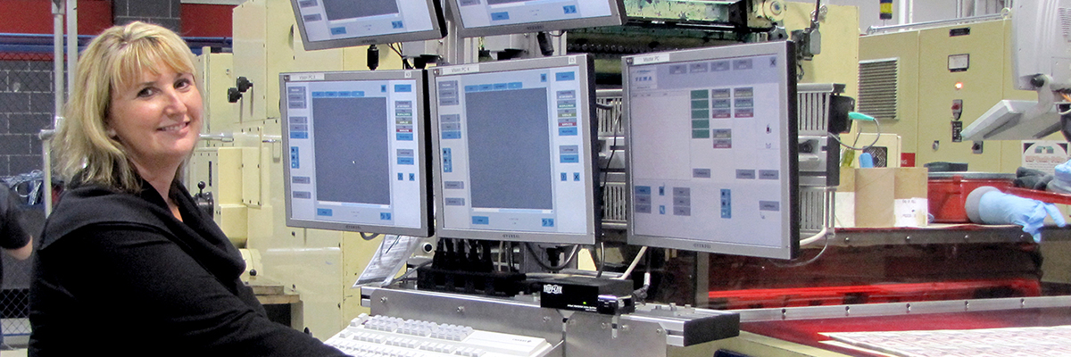 Woman operating the COPE-PAK machine.