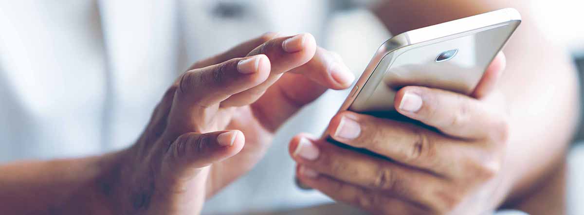 Two hands holding a smart phone