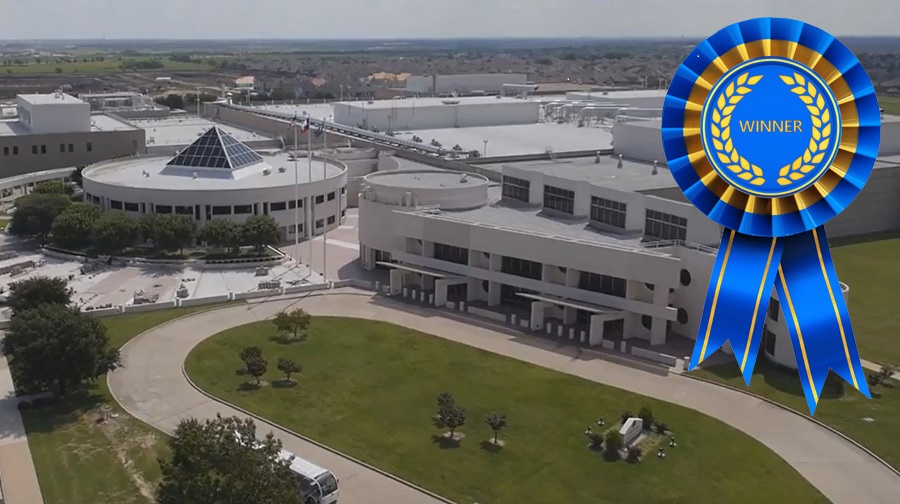 Aerial view of Western Currency Facility with blue Winner ribbon.